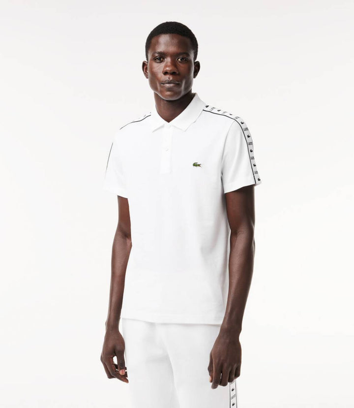 Polo Lacoste à bande grifféé blanc